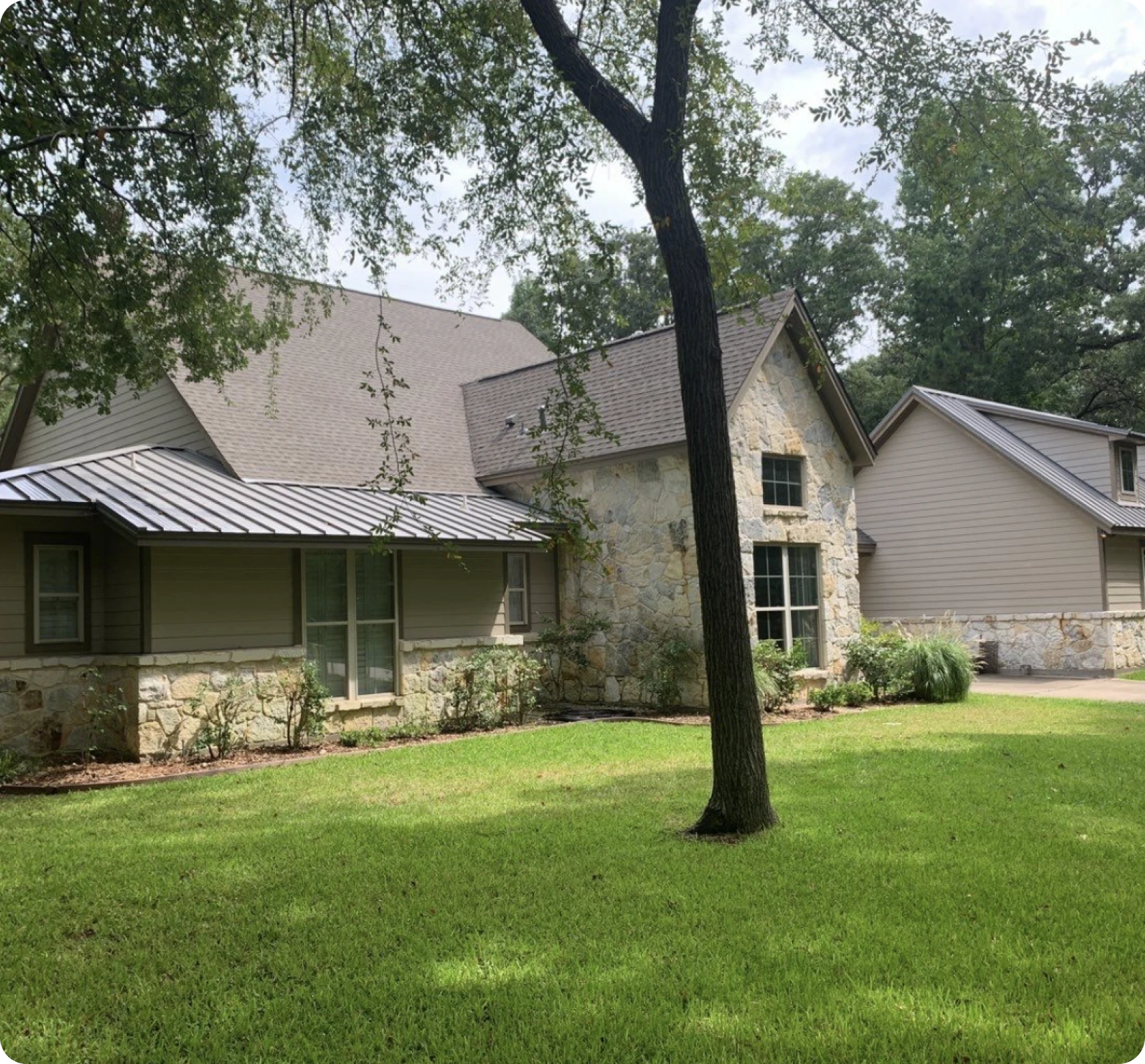 Suburban house with stone and siding exterior.